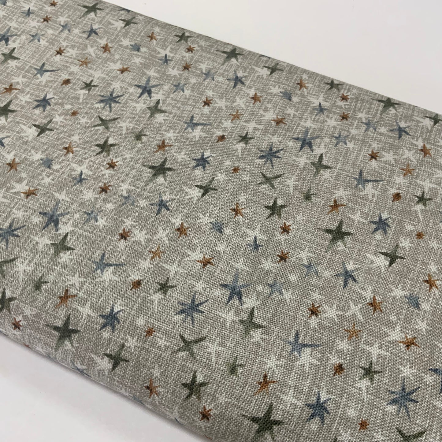 Stars on Taupe (Grey) Textured Background