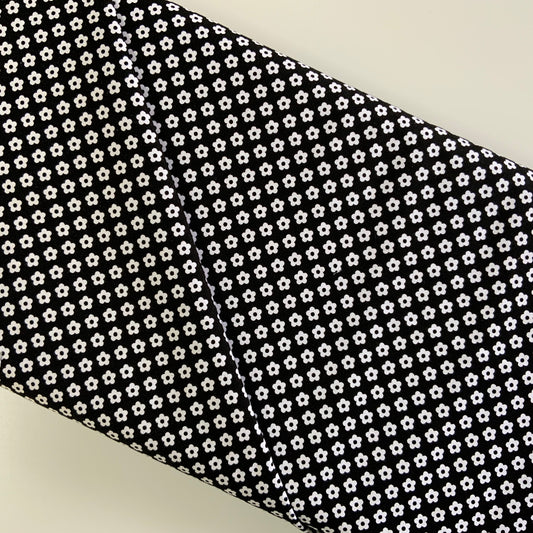 Dot And Dash White Flowers on Black Linear